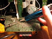 Solders can be removed using a vacuum plunger (on the right) and a soldering iron.
