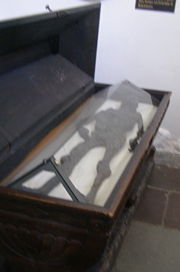The glass-covered coffin of the Haraldskær Woman.