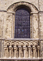 The "blind arcade" beneath this window at Canterbury Cathedral has overlapping arches forming points, a common decorative feature of Romanesque architecture in England.