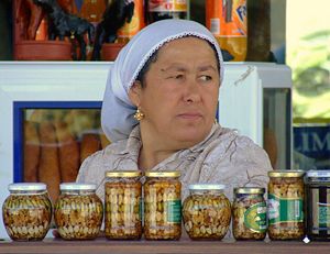A woman selling nuts at a roadside in Izmir Province, Turkey.