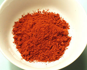 A small bowl of hot smoked Spanish paprika.