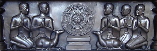 The first five disciples pay respects to the Wheel of the Dharma at the deerpark of Isipatana.