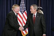 Buckley shakes hands with President George W. Bush on October 6, 2005