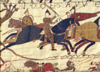 Bishop Odo, likely originator of the Tapestry, seen spurring his troops forward