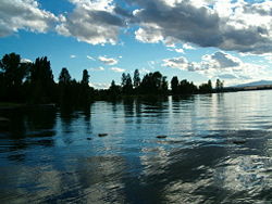 Some clouds over Flathead Lake in Polson, Montana as the sun is setting