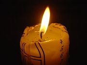 An Advent candle burning on the fourth day of December.
