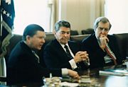 President Reagan (center) receives the Tower Commission Report in the White House Cabinet Room; John Tower is at left and Edmund Muskie is at right, 1987
