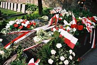 Grave of Piłsudski's mother in Vilnius, Lithuania. The huge black tombstone is inscribed: "MATKA I SERCE SYNA" ("A mother and the heart of her son") and bears evocative lines from a poem by Słowacki.