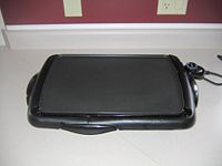 Electric griddle with temperature control.