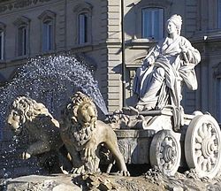 The famous fountain in Madrid depicting Cybele in a chariot drawn by lions, in the Plaza de Cibeles.