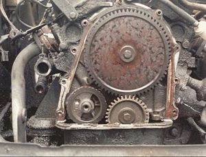 Valve timing gears on a Ford Taunus V4 engine — the small gear is on the crankshaft, the larger gear is on the camshaft. The crankshaft gear has 34 teeth, the camshaft gear has 68 teeth and runs at half the crankshaft RPM.(The small gear in the lower left is on the balance shaft.)