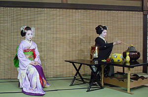 Maikos taking part in a tea ceremony.