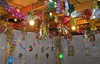 Festive decor is featured inside of a contemporary sukkah
