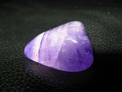 A polished amethyst gemstone.