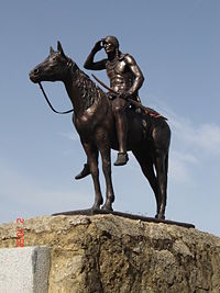 Scout Indian statue in Seville, sistered with Kansas City. Kansas City has an almost identical statue in Penn Valley Park, near the Liberty Memorial that is pointing in the direction of Seville.