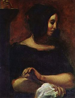George Sand as portrayed by Eugène Delacroix in 1838. This portrait was originally part of a larger painting showing both George Sand and Frédéric Chopin.