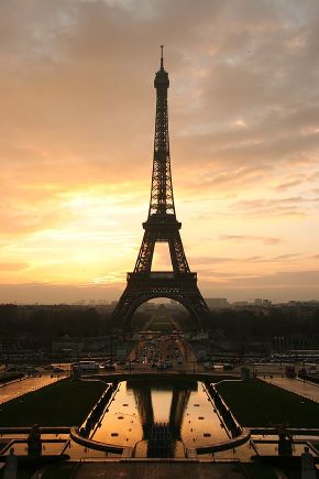 Icon of Paris, the Eiffel tower at sunrise.