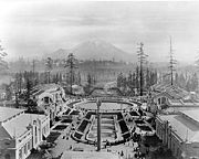 Alaska-Yukon-Pacific Exposition on the campus of the University of Washington in Seattle in 1909. In the background is Mount Rainier. Cropped from the original at the UW Libraries Special Collection.