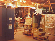 Worker monitoring melting zirconium oxide and yttrium oxide in an induction heated "cold crucible" to create cubic zirconia.