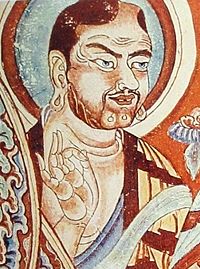 A Buddhist making the "Vitarka Mudra." Image from the Tarim Basin, ninth century.