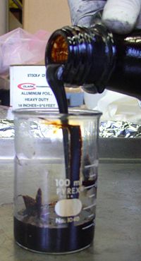 Tar can be produced from corn stalks by heating in a microwave. This process is known as pyrolysis.