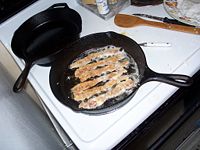 Bacon frying in bacon grease.