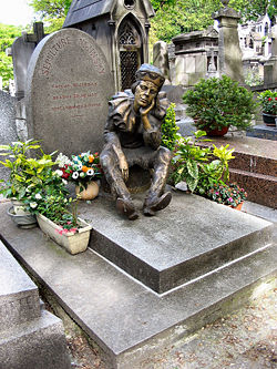 Tombstone of Vaslav Nijinsky in Cimetière de Montmartre in Paris. The statue shows Nijinsky as the puppet Petrouchka.