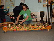Those in the Sulu Archipelago play the kulintang on the floor.