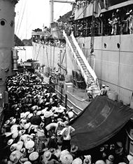 Anti-communist Vietnamese refugees moving from a French LSM landing ship to the USS Montague during operation Passage to Freedom in 1954.