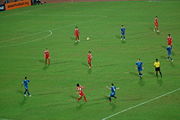 Singapore (in blue jerseys) and Thailand (red) during the first leg of the AFF Football Championship finals at the National Stadium in Singapore on January 31, 2007. Before the match started the national anthems of both countries were performed. Singapore eventually won 2–1.