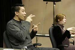 Two sign language Interpreters working as a team for a school.