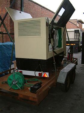 Side view of a large Perkins diesel generator, manufactured by F&G Wilson Engineering Ltd. This is a 100 kVA set.