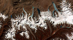 This image shows the termini of the glaciers in the Bhutan Himalaya. Glacial lakes have been rapidly forming on the surface of the debris-covered glaciers in this region during the last few decades.