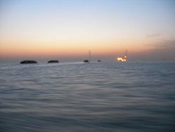 Ships on the Yangtze at dawn with bridge in the distance (near Nantong).