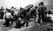 A British 60-pounder (5 inch) gun at full recoil, in action during the Battle of Gallipoli, 1915.