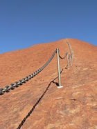 Though the Aboriginal peoples, traditional owners of the land, consider climbing Uluru to be sacred desecration, a walking trail with an assistance chain has been installed on Uluru.