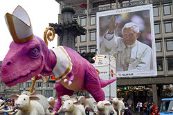 A sculpture of a dinosaur and sheep seen as criticism of the church/pope