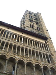 Santa Maria della Pieve, Arezzo, has a screen front with varied tiers of colonettes.