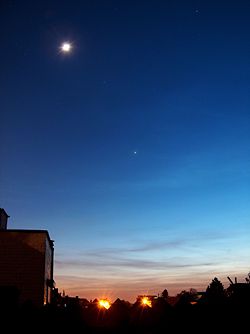 High up in the sky, the moon appears smaller.