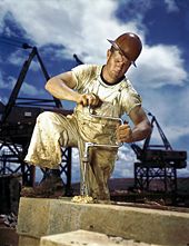Carpenter (wearing a union badge) at work during the 1942 construction of the Douglas Dam in East Tennessee.