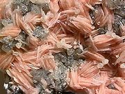 Crystals of barite (pink) mixed with cerussite (clear) from Morocco.
