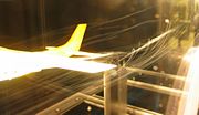 A model Cessna with helium-filled bubbles showing streamlines of the wingtip vortices.