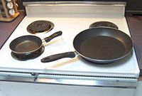 Large and small skillets.