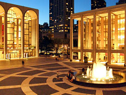 Avery Fisher Hall (right) and the Metropolitan Opera House at twilight