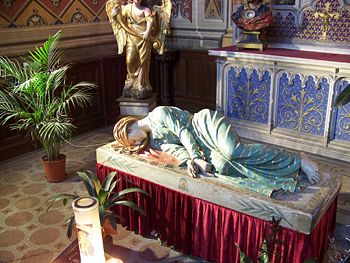 Statue of Saint Cecilia with bloodied cloth by her neck in the Cathedral Saint-Cecilia in Albi