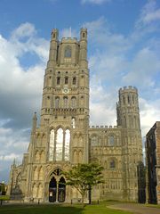 Ely Cathedral, England, had an elaborate west front with its central tower framed by smaller towers showing transitional features, 1180s. One of the smaller towers fell. Porch, 1250s; lantern, 1390s.