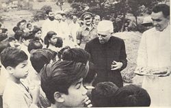 Nehru distributing sweets to children in Guwahati.