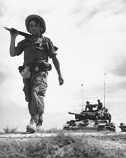 A French Foreign Legion unit patrols in a communist controlled area.