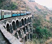 A typical passenger train on one of the line's big bridges.