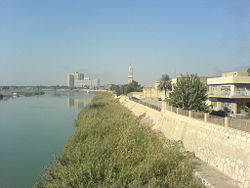 Tower clock of the qishla of Baghdad with Medical City in the background, 2005